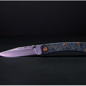 Buck 110 Slim Pro TRX blade showing Buck USA tang stamp and satin-finished MagnaCut steel