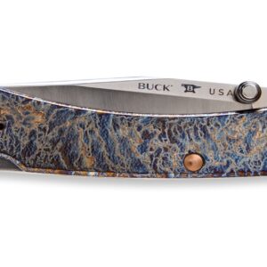 Buck USA tang stamp close-up on MagnaCut steel blade with oil slick titanium handle