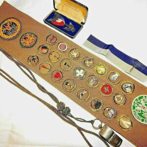 1930s Eagle Scout Collection - Robbins Type 2A Medal in coffin box, merit badge sash with 22 rare badges, patches, whistle and lanyard
